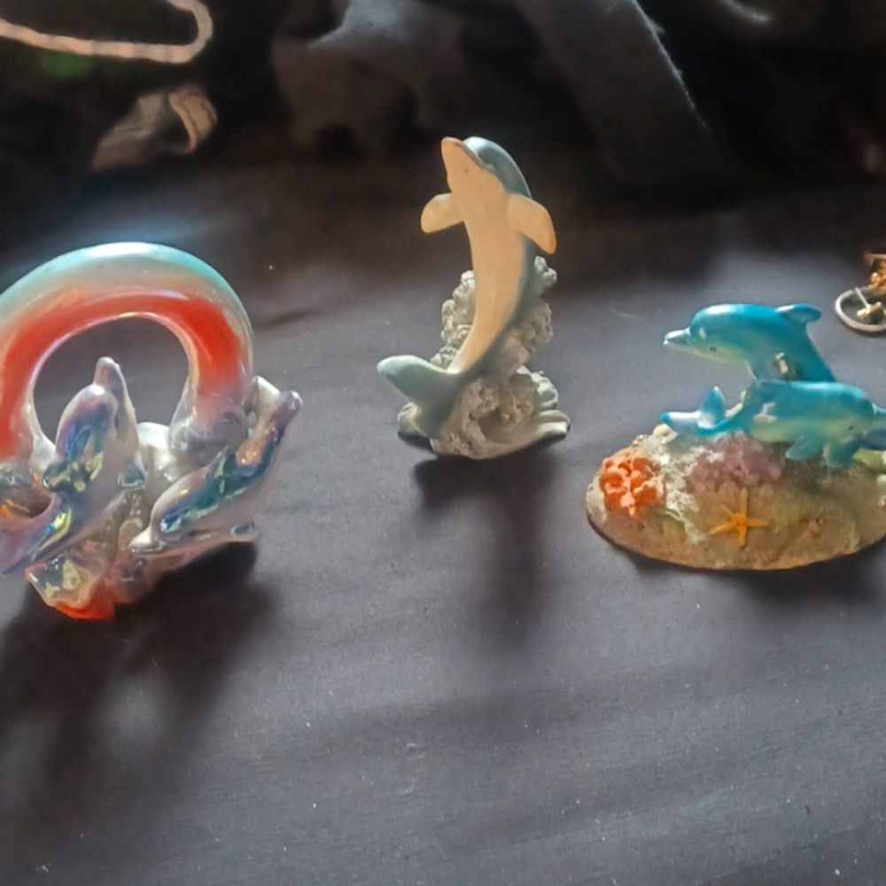Glass dolphin figurines